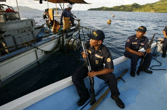 palawan security forces inspect shipping boat 