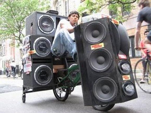 bicycle carying huge speakers