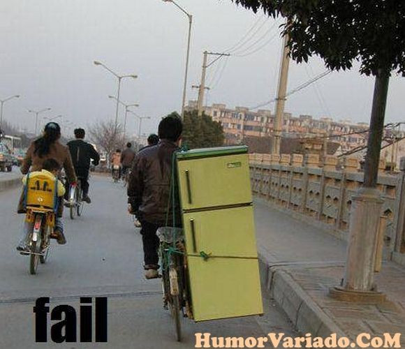 man carying fridge on two weelie bicycle