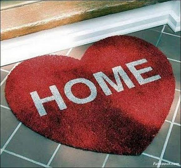 hearth shaped doormat with Home written