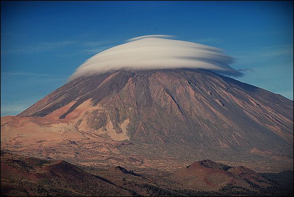 mountain top hidden by clouds 