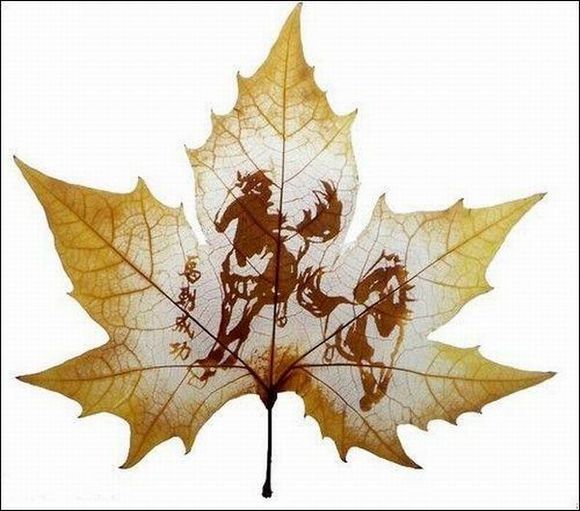 horses running carved on leaf
