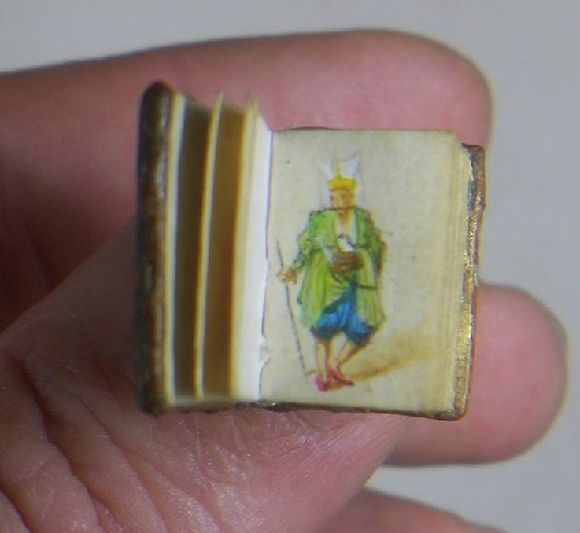 micro painting on a tiny book 