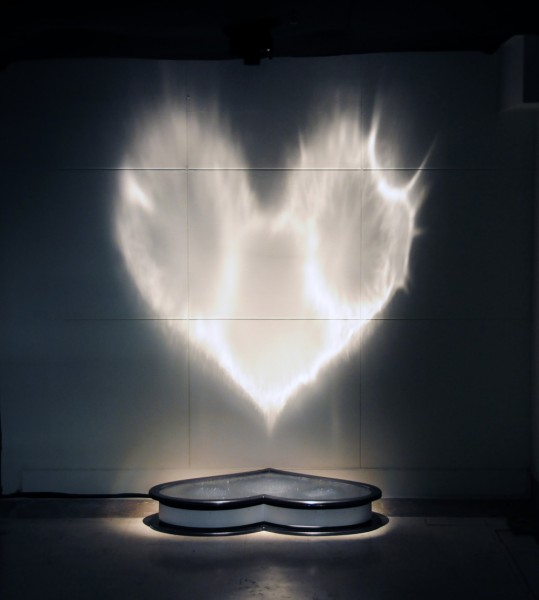 Hearth shaped object created with water light electronic and music