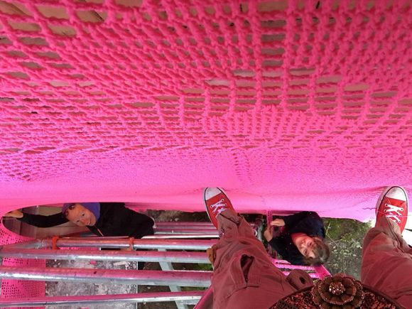 house covered in pink crochet